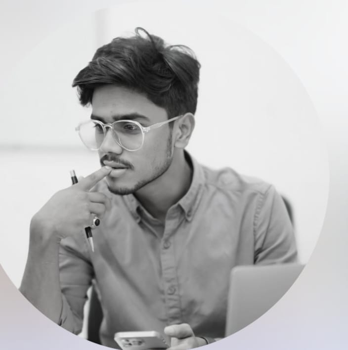 An entrepreneur sitting with laptop working on business strategy